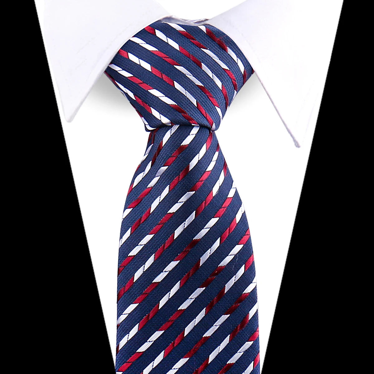 A navy blue and red striped silk necktie tied in a knot against a white shirt.