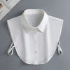 A white elegant detachable button-up collar shirt displayed flat on a gray surface.