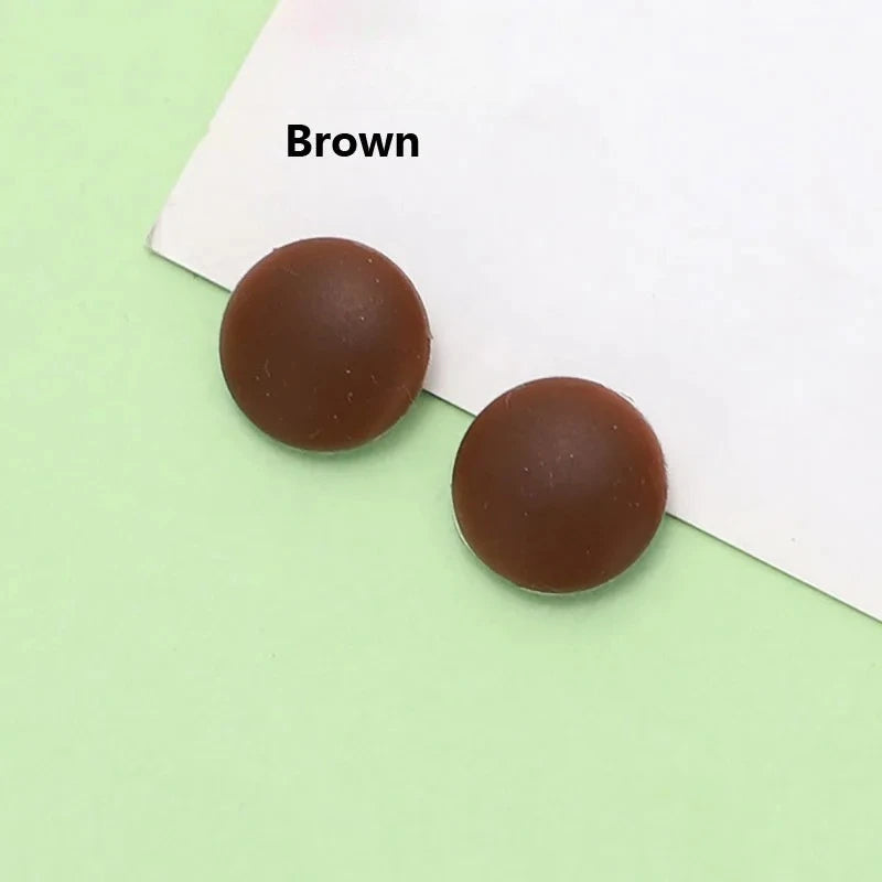 Two brown silicone eyeglass grips placed on a white background.