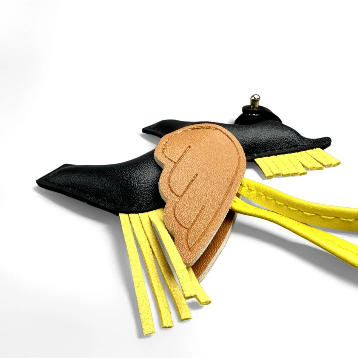 A black and gold elegant winged pony keychain featuring a leather wing design.