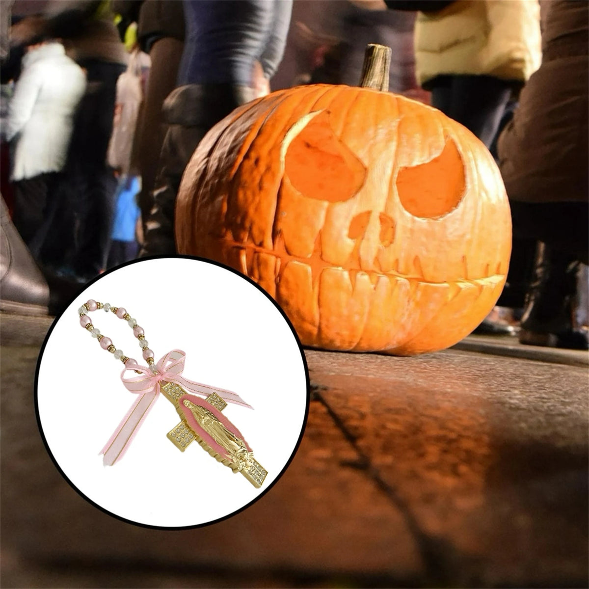A golden carved pumpkin Halloween decoration next to a pink and gold Catholic charm.