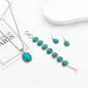 A set of vintage turquoise stone jewelry including a necklace, earrings, and bracelet displayed on a white background.