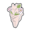 A cute, stylized cat face design featuring pink and green floral elements.