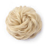 A ball of light blonde hair used as a messy bun hair piece for curly updos.