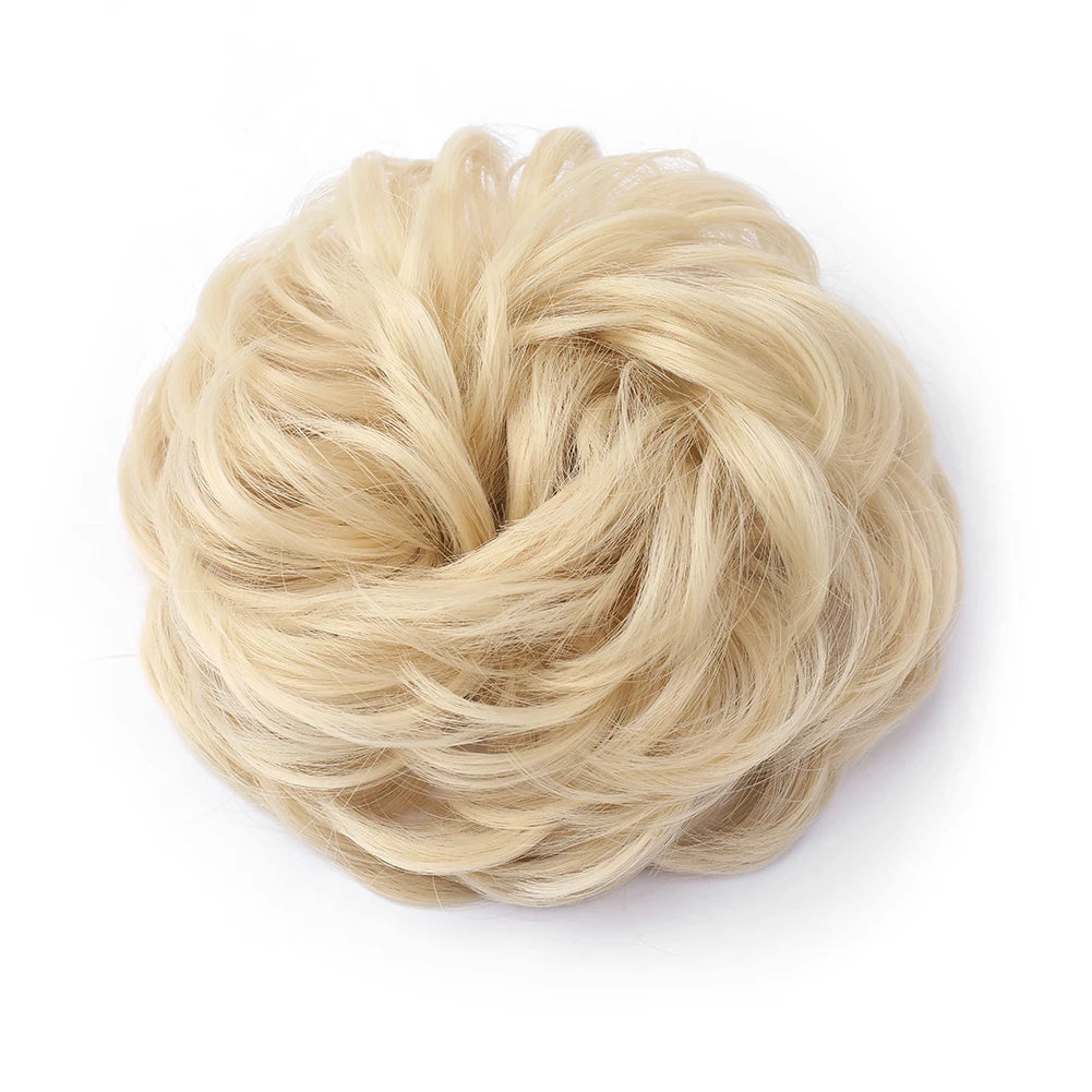 A ball of light blonde hair used as a messy bun hair piece for curly updos.