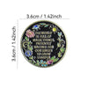 Round lapel pin featuring an inspirational quote surrounded by floral and star designs on a black background.