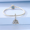 Sterling silver devil's eye charm bracelet with a round blue gemstone and a pendant charm
