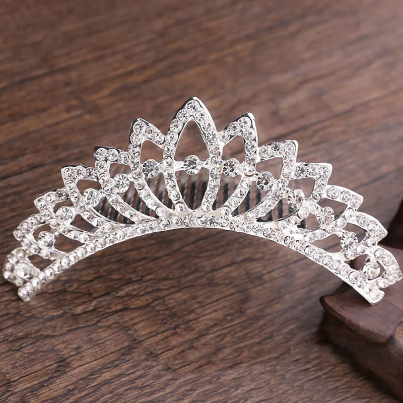 A sparkling crystal princess tiara hair comb for women with a floral crown design.