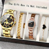 A gift box containing a gold-toned watch, a gold chain, and a rose gold-toned watch and a black heart pendant.