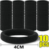 Ten black elastic hair bands stacked and one laid out, measuring 4cm wide.