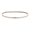 A skinny leather belt with a gold buckle and light beige stitching.