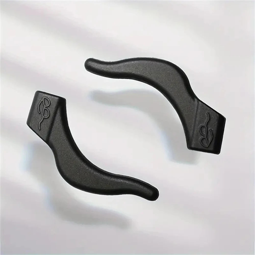 A pair of black silicone anti-slip ear hooks for eyeglasses.