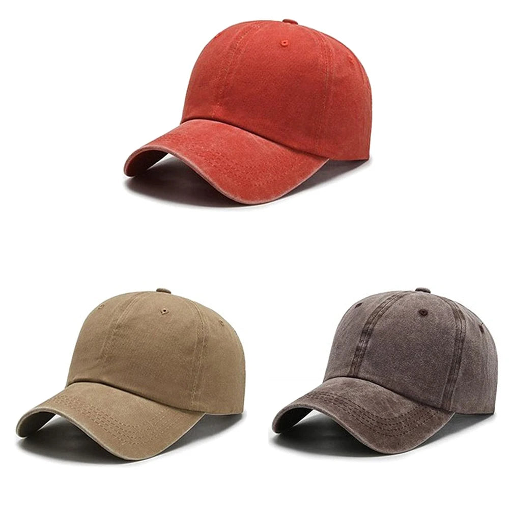 A pair of casual baseball caps, one in burnt orange and one in olive green.