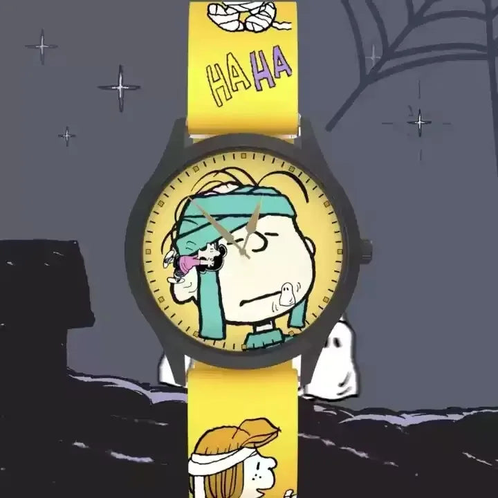 Gelbe Uhr mit einer Cartoon-Figur, die eine blaue Stirnband und den Text HAHA am Armband trägt.