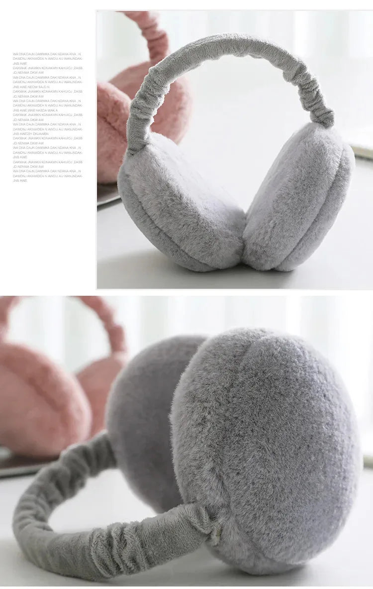 A close-up of a gray plush fur ear warmer or earmuff designed for winter protection.