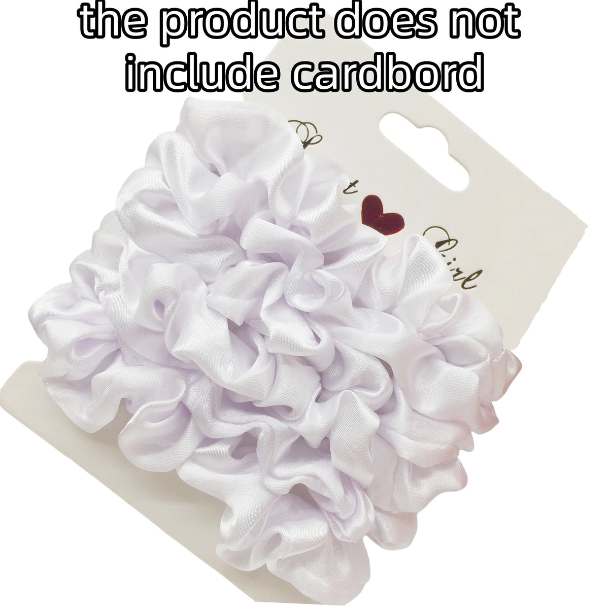 A white satin hair scrunchies set is displayed on a cardboard backing.
