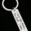 Silver keychain with a loop and a tag engraved with the message I love you more I win