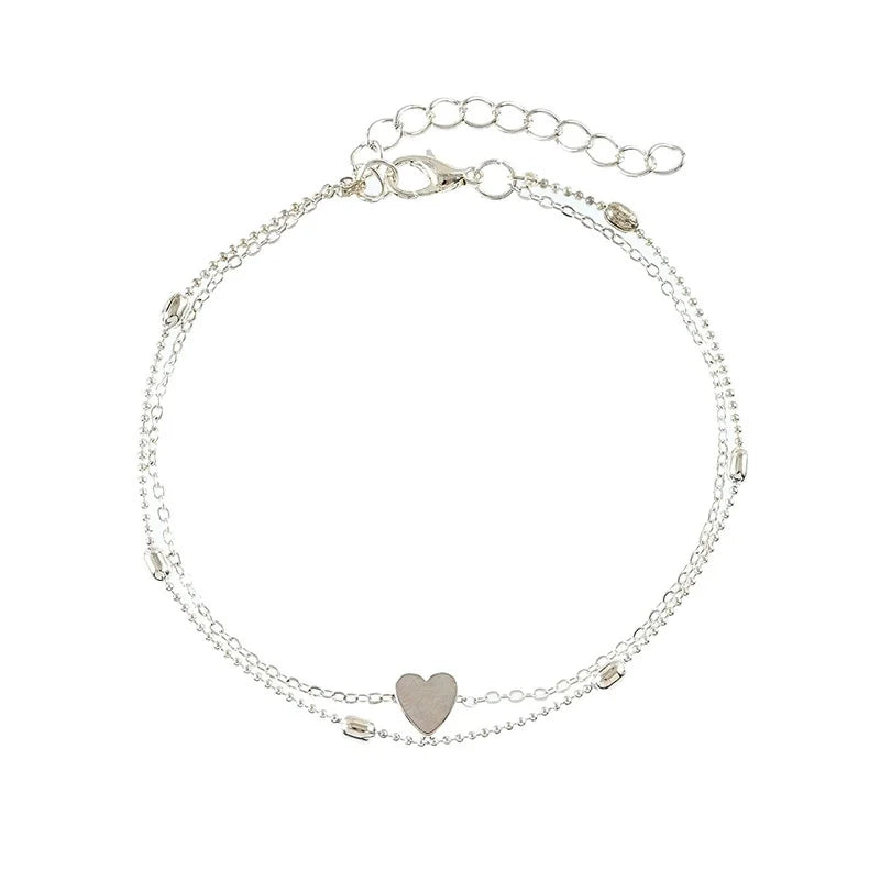 Charmant bracelet à cheville en perles argentées avec un pendentif cœur pour femmes
