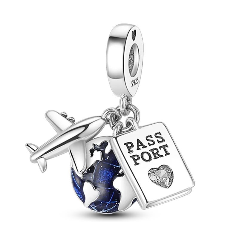 Sterling silver charm bracelet featuring a passport pendant and a globe charm.