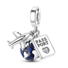 Sterling silver charm bracelet featuring a passport pendant and a globe charm.