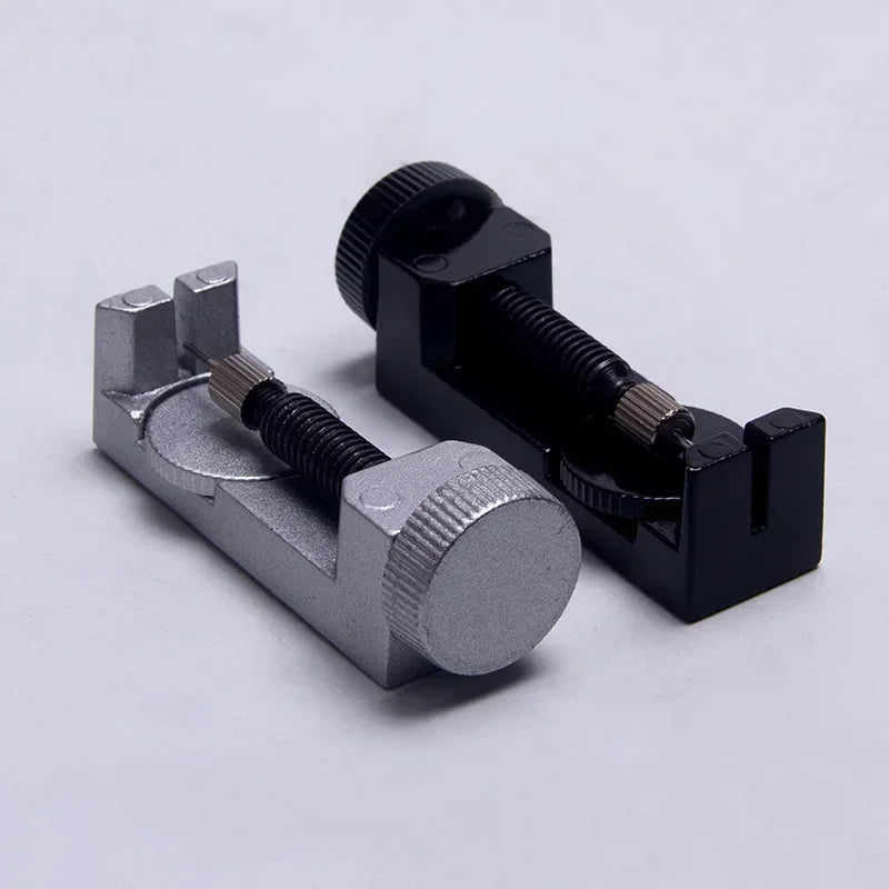 A set of three precision watch link pin remover tools, featuring silver and black components.