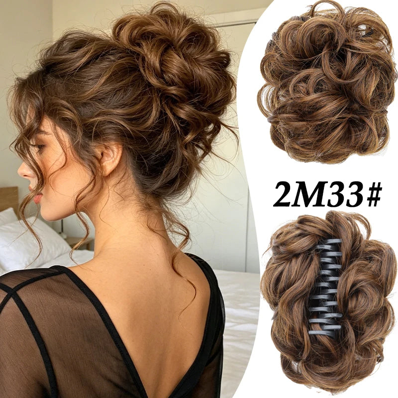A woman shows off a voluminous curly messy bun hairstyle with a black claw clip hair accessory.
