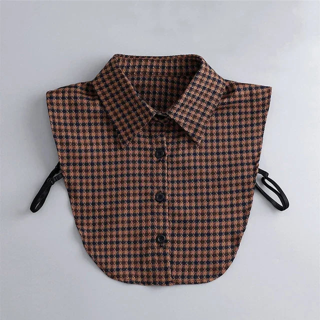 A brown and navy checkered shirt with a false collar and detachable necklines.