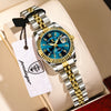 A silver and gold watch set with luminous hands and date display resting on a light-colored surface.