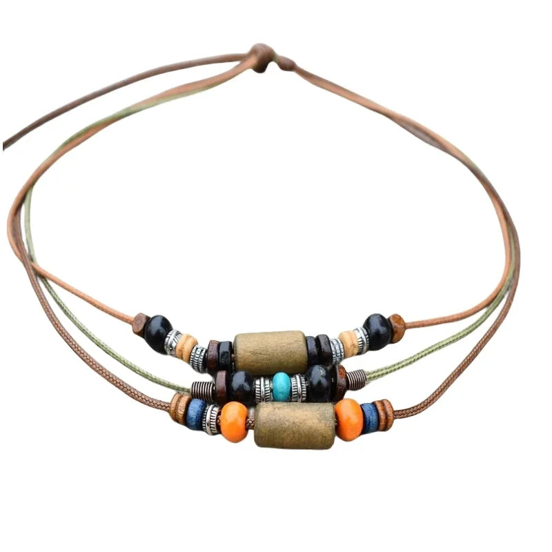 Boho vintage wood bead necklace set featuring various natural wood and stone beads on leather cord.