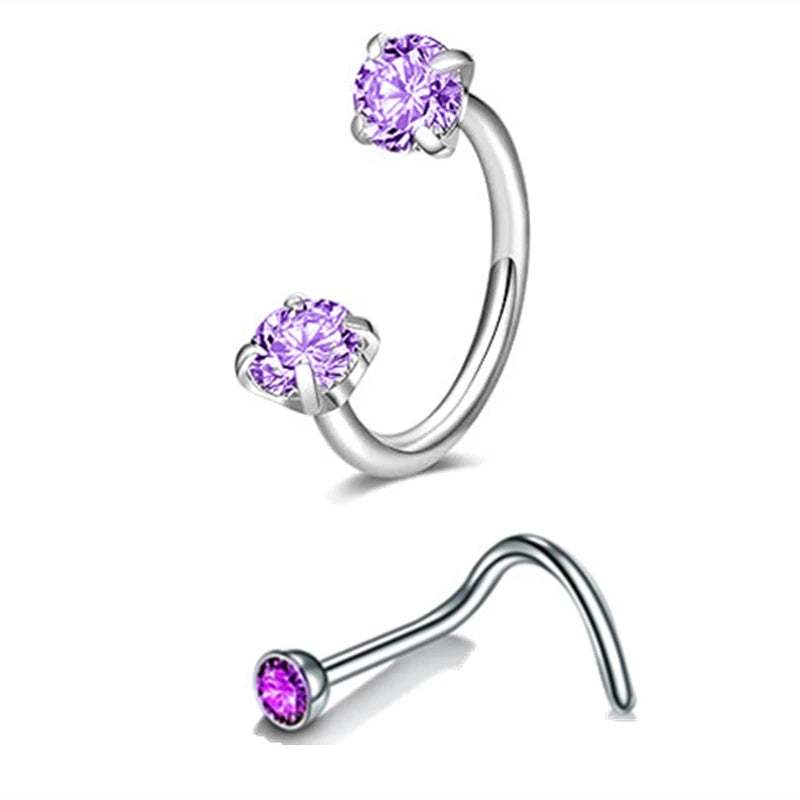A set of silver horseshoe nose rings featuring purple gemstone studs.