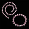A set of sparkling heart rhinestone necklaces and bracelets arranged in a spiral pattern.