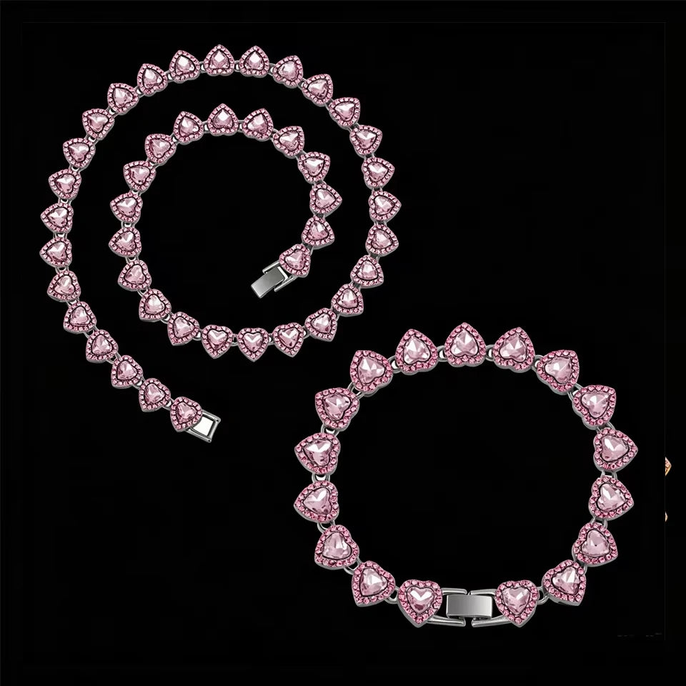 A set of sparkling heart rhinestone necklaces and bracelets arranged in a spiral pattern.