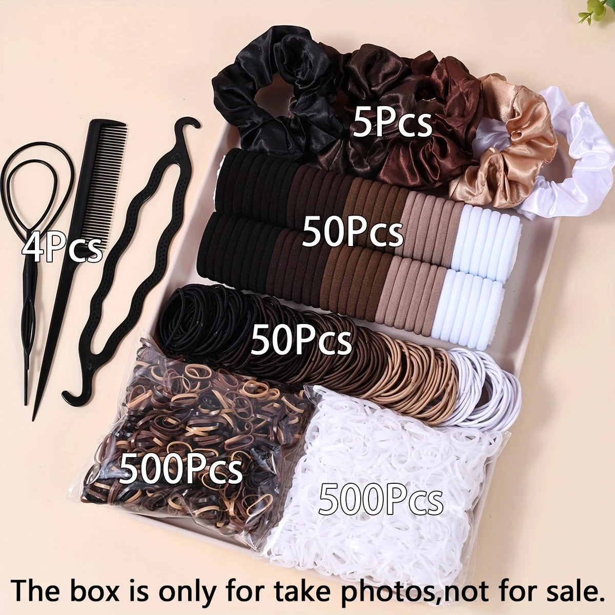 Une boîte contenant divers accessoires de cheveux élastiques noirs, bruns et blancs à vendre.