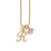 A gold chain necklace featuring an initial P and a flower charm.