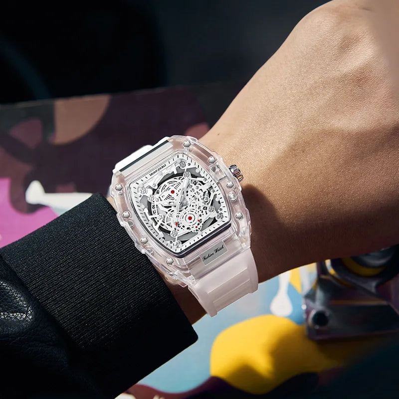 A close-up of a clear silicone watch with an intricate dial and silver accents worn on a wrist.