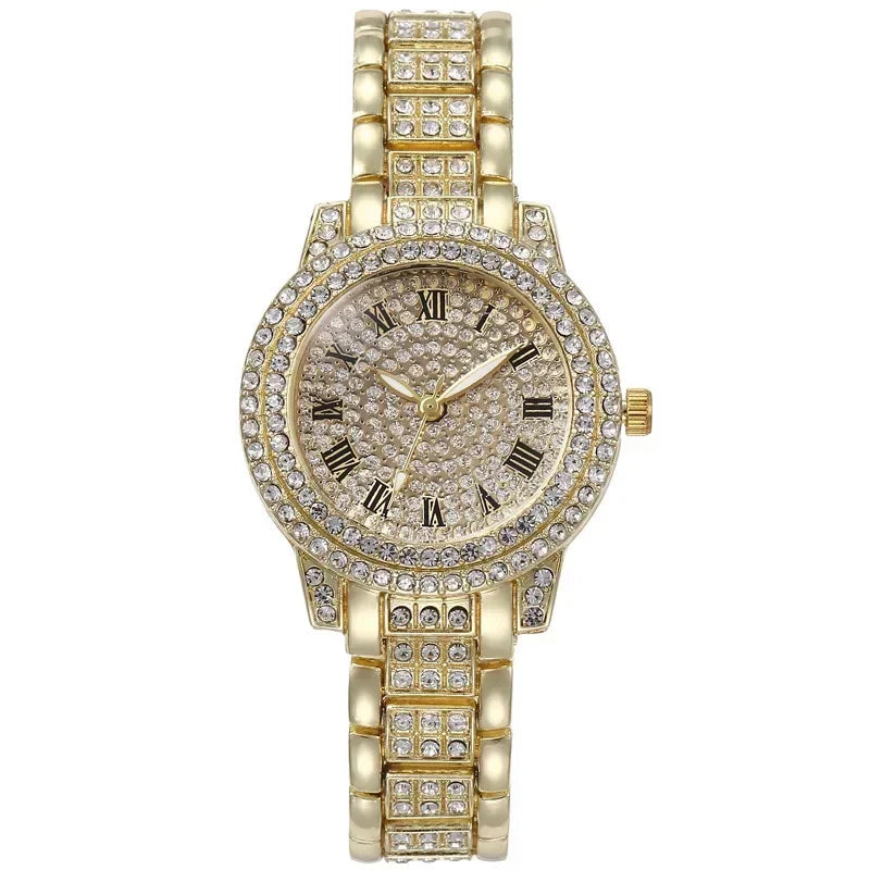 A gold-toned quartz wristwatch adorned with clear rhinestones on the bezel and bracelet.