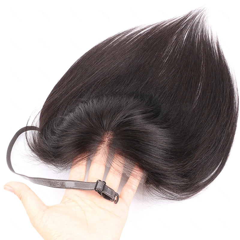 A hand holds a dark black lace front hair topper, showing the natural hairline area.
