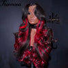 A dark hair wig with vibrant red ombre highlights and wavy texture displayed against a black background.