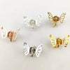 A collection of ten mini hollow butterfly metal hair clips in gold and silver tones.