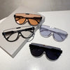 A collection of vintage cat eye sunglasses in various shades and styles displayed on a white surface.