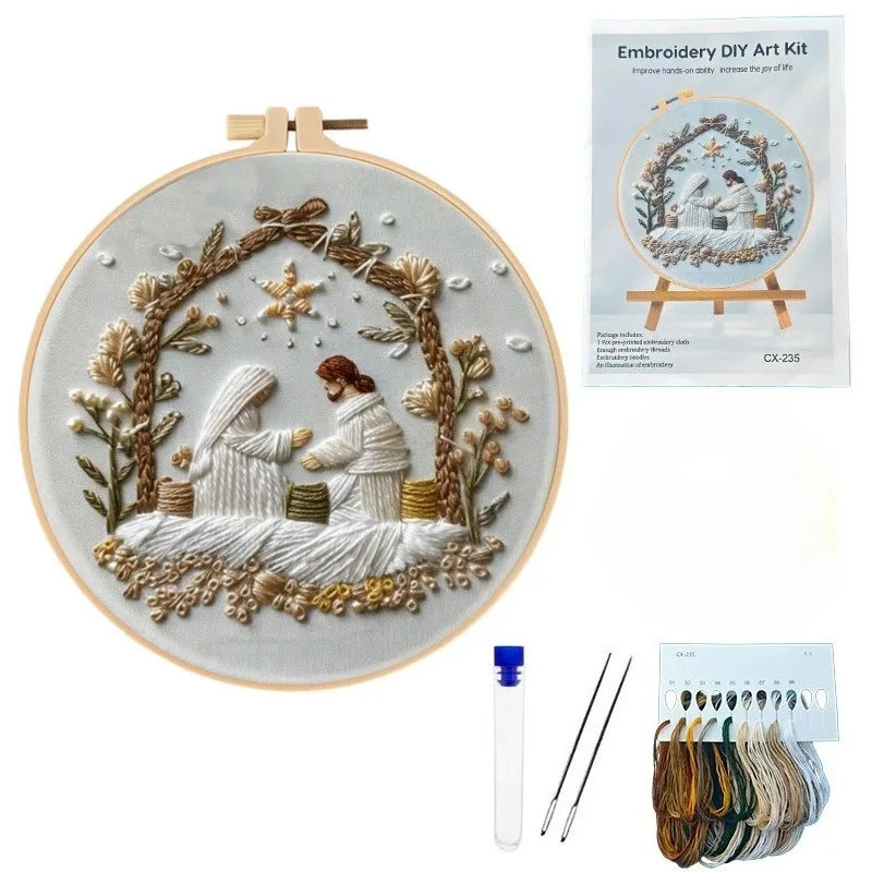 Embroidery DIY Art Kit featuring a circular design of a woman and a bird in a wreath on a light fabric