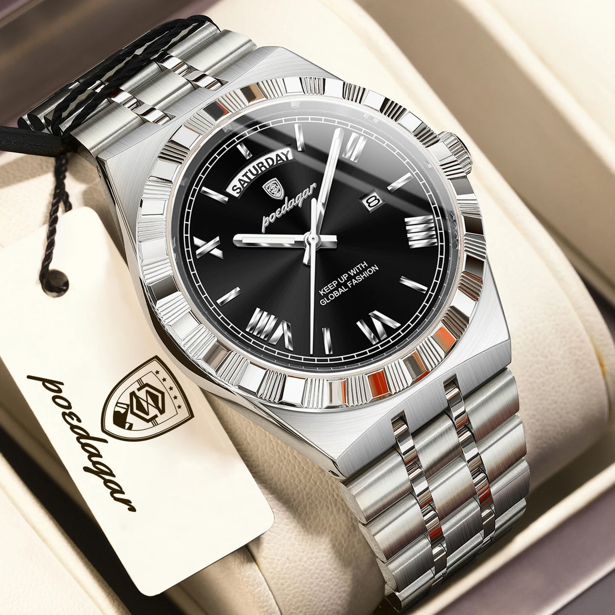 A silver-toned men's watch with a black dial and luminous hands is displayed in a box.