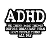 Black and white enamel lapel pin featuring the text ADHD and a related phrase.