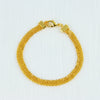 A gold-plated necklace set featuring a chain and a pendant, displayed against a white background.