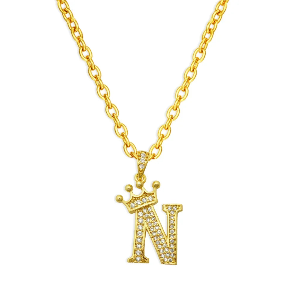 Gold chain necklace with an initial N pendant shaped like a crown