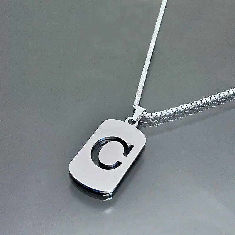 A silver stainless steel pendant necklace featuring a large letter C on a chain.