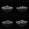 Silver crystal hair crown for women shown in multiple angles on a black background