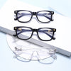 A set of black and clear square eyeglasses displayed on a white background.