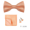 A peach colored men's bow tie and cufflinks set displayed on a white background.