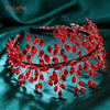 A close-up of a red rhinestone bridal headband featuring delicate floral and vine designs.